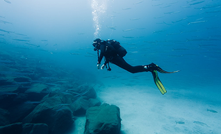 Scuba diving travel gear packed securely with regulators, dive computer, and accessories