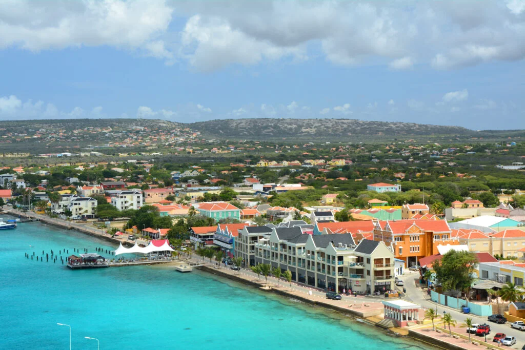 Waterfront promenade and coastal architecture of Kralendijk, Bonaire alongside clear turquoise Caribbean waters