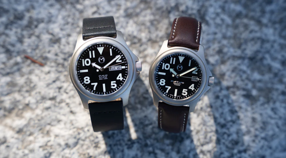 Momentum Atlas titanium sports dive watch with screw-down crown and illuminated numerals on dial