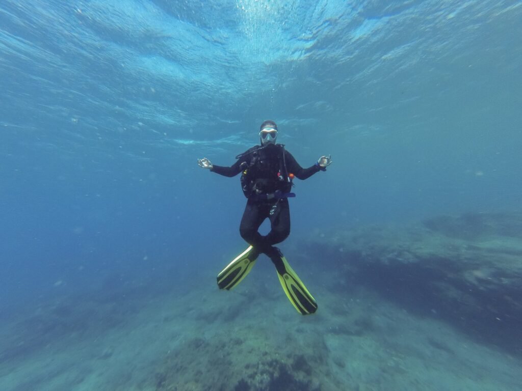 Person practicing yoga breathing and stretching pose on mat to improve diving breath control